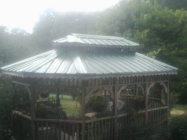 Two tier green metal roof on a garden gazebo in Wilsons Mills